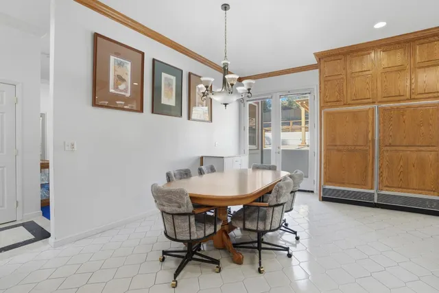 a front view of a house with a yard table and chairs