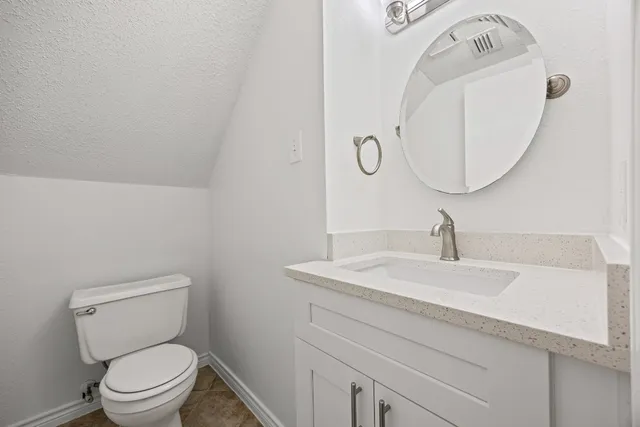 a white bath tub sitting next to a shower