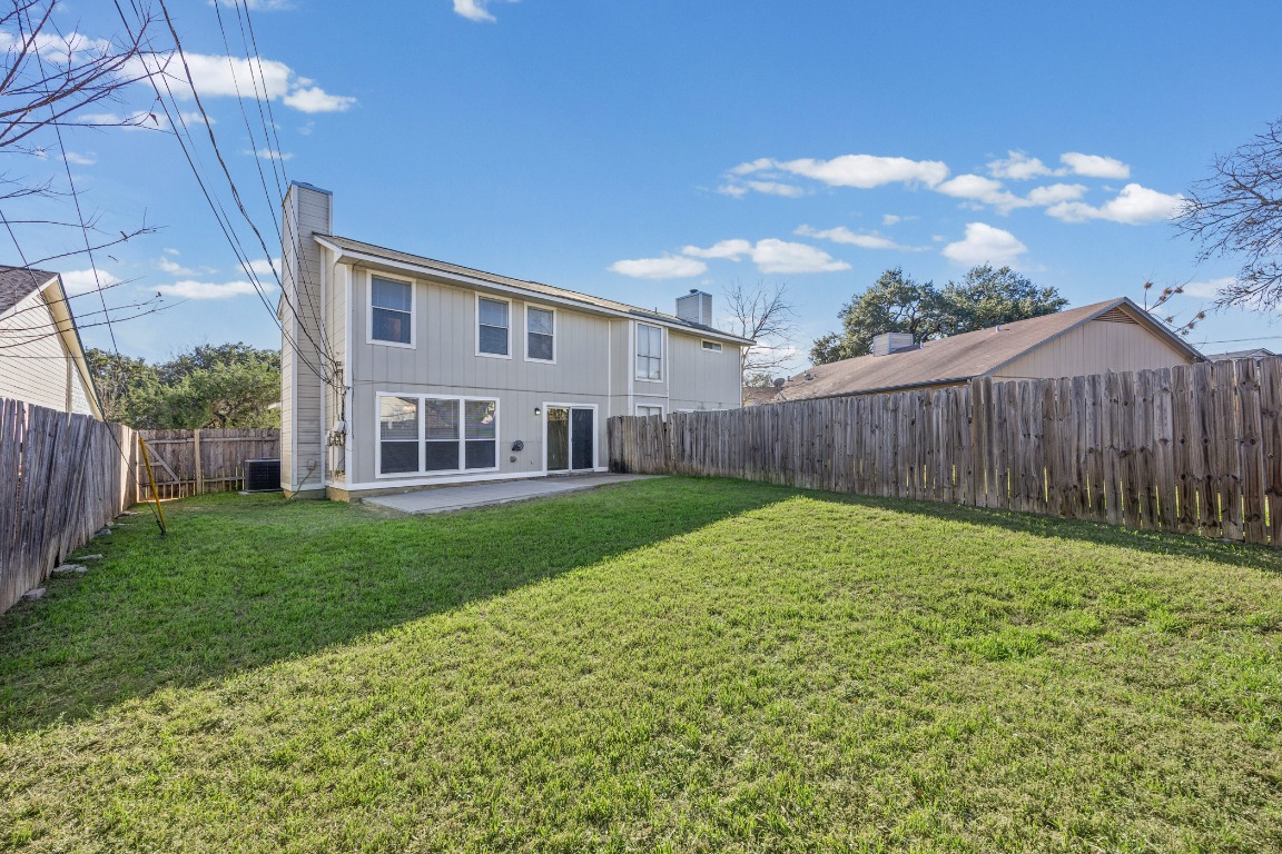 2630 Alcott Lane, Unit A Austin, TX 78748 - Photo 26 of 32 Rear view of house with a patio area, a chimney, and a fenced backyard