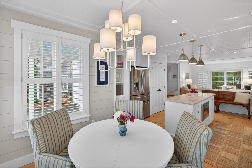 23 Cobblestone Plymouth, MA 02360 - Photo 13 of 39 a view of a dining room with furniture a chandelier and wooden floor