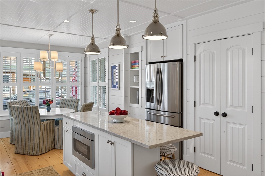 23 Cobblestone Plymouth, MA 02360 - Photo 14 of 39 a kitchen with stainless steel appliances a sink a refrigerator a center island and windows