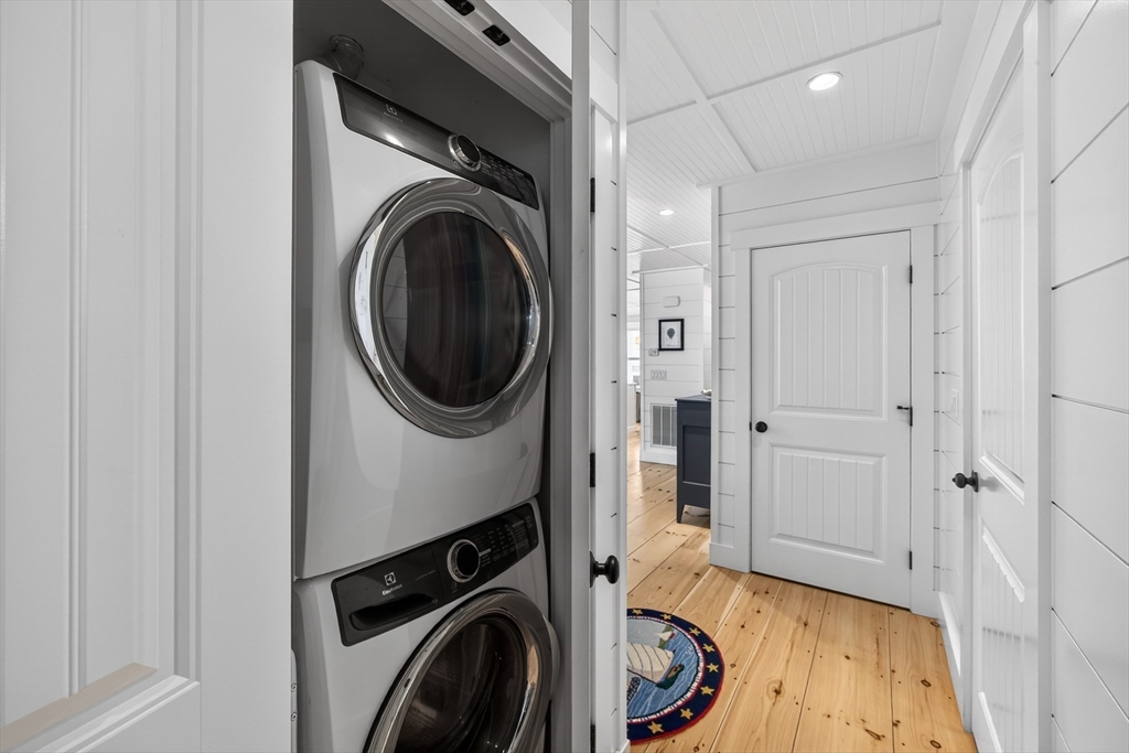 23 Cobblestone Plymouth, MA 02360 - Photo 16 of 39 a view of a hallway with washer and dryer