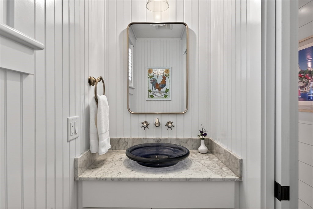 23 Cobblestone Plymouth, MA 02360 - Photo 17 of 39 a bathroom with a granite countertop sink and a mirror