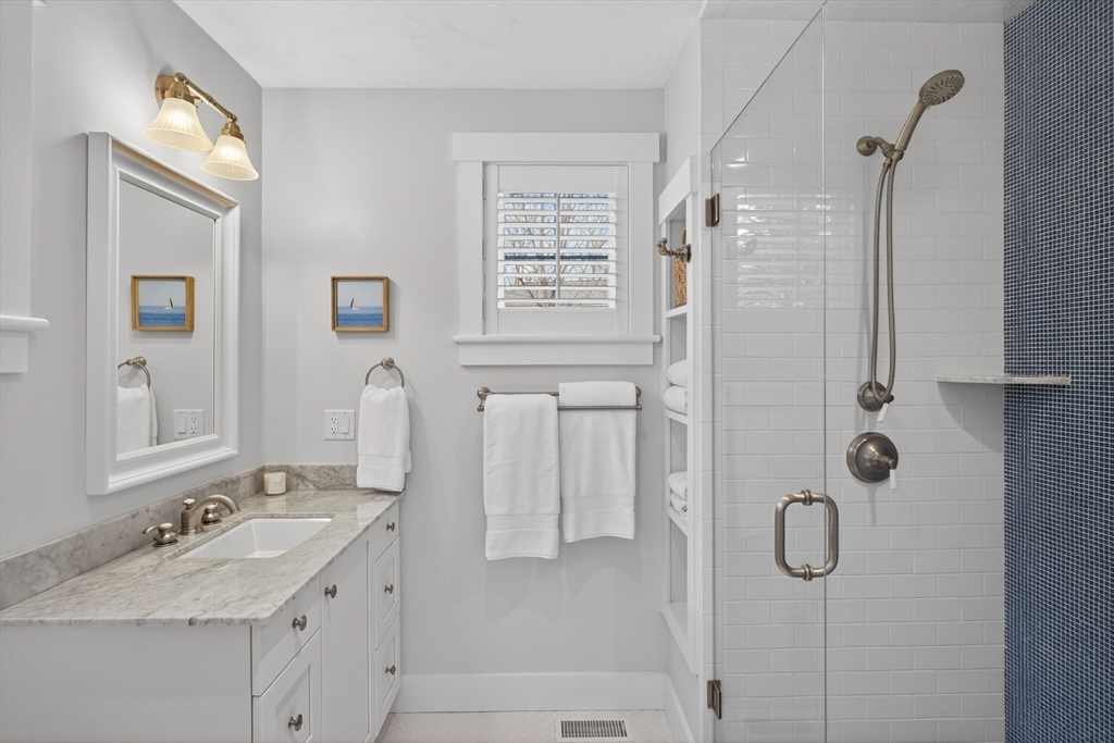 23 Cobblestone Plymouth, MA 02360 - Photo 19 of 39 a bathroom with a granite countertop sink a shower and a mirror