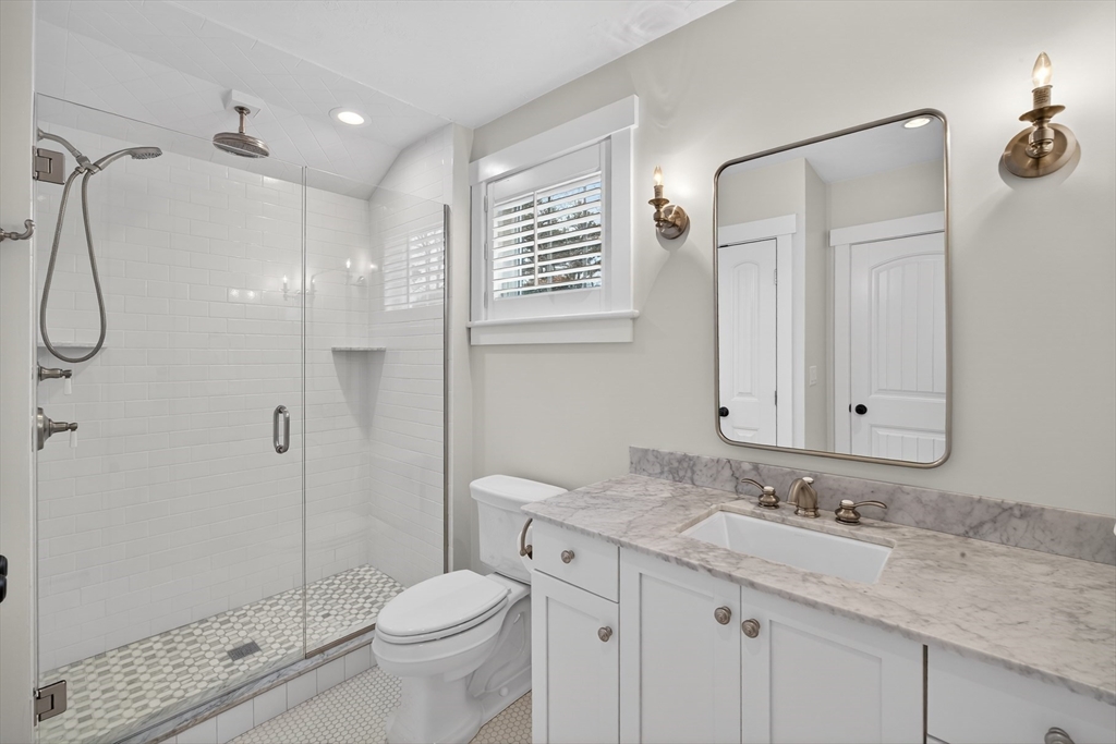 23 Cobblestone Plymouth, MA 02360 - Photo 24 of 39 a bathroom with a granite countertop sink a toilet and shower