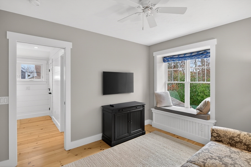 23 Cobblestone Plymouth, MA 02360 - Photo 26 of 39 a living room with a bed furniture and a window