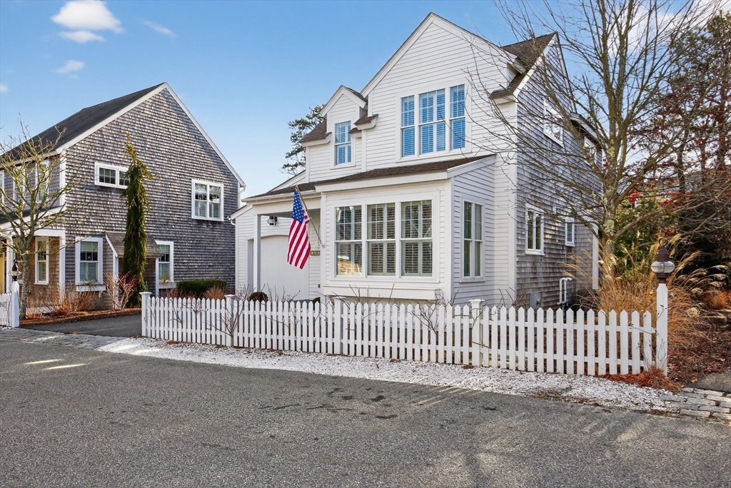 23 Cobblestone Plymouth, MA 02360 - Photo 29 of 39 a front view of a house with a fence