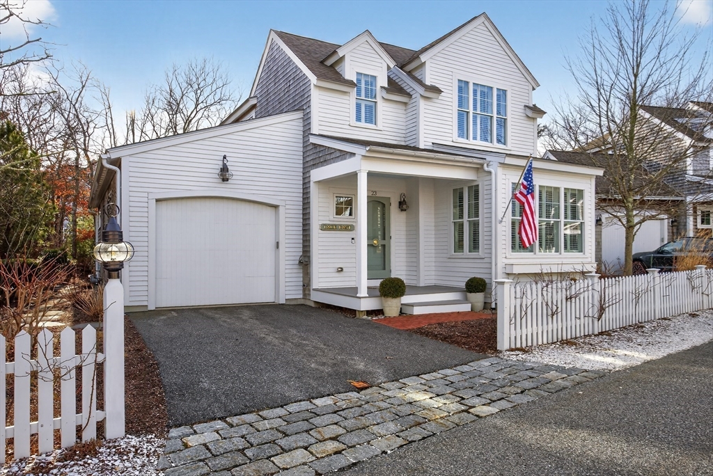 23 Cobblestone Plymouth, MA 02360 - Photo 30 of 39 a view of a white house with large windows and a tree