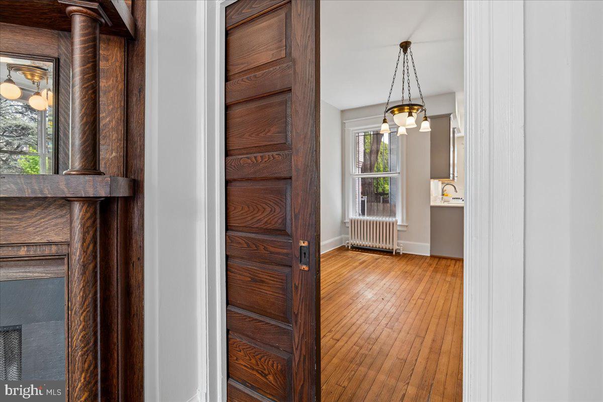 1105 G Street Southeast Washington, DC 20003 - Photo 15 of 51 Original pocket door separating Living and Dining