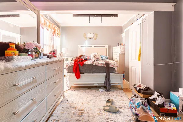 a bedroom with bed and window