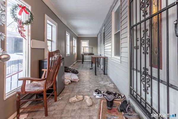 a view of a entryway with furniture and staircase