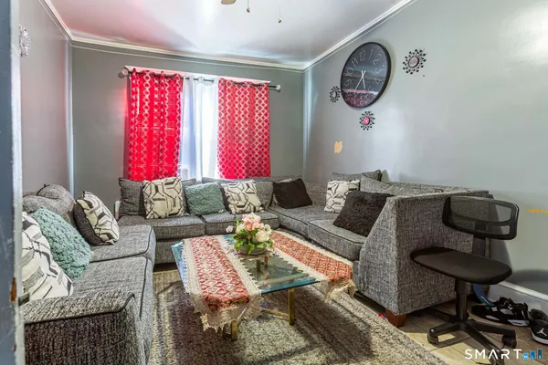 a living room with furniture and a window