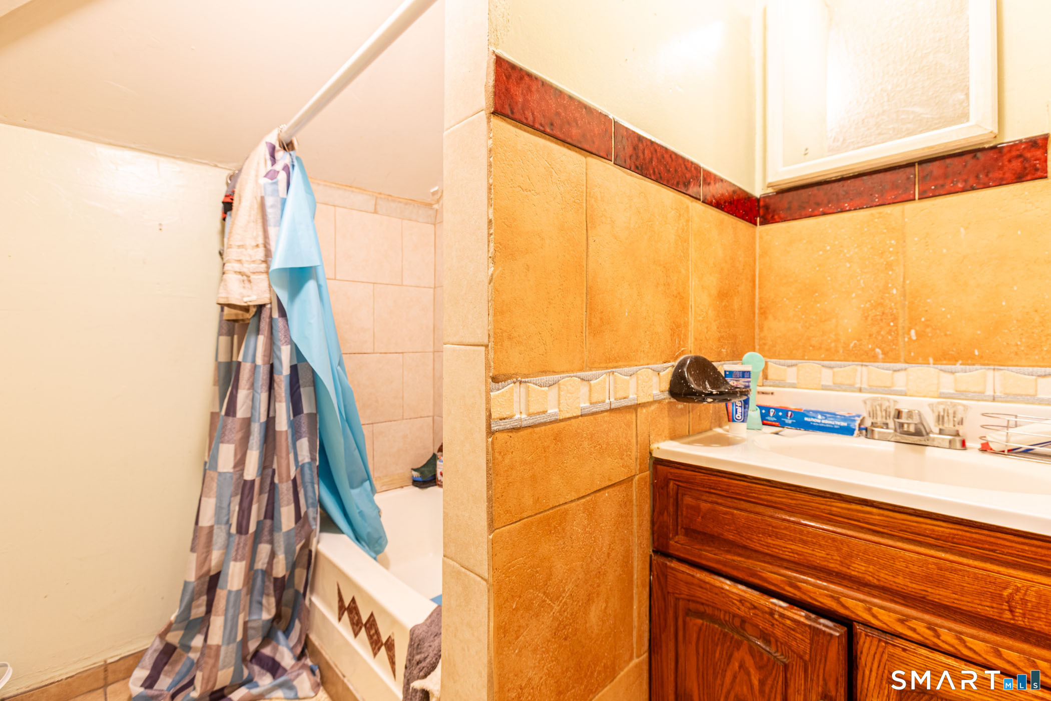 34 Adams Street Hartford, CT 06112 - Photo 28 of 39 a bathroom with a sink and a mirror