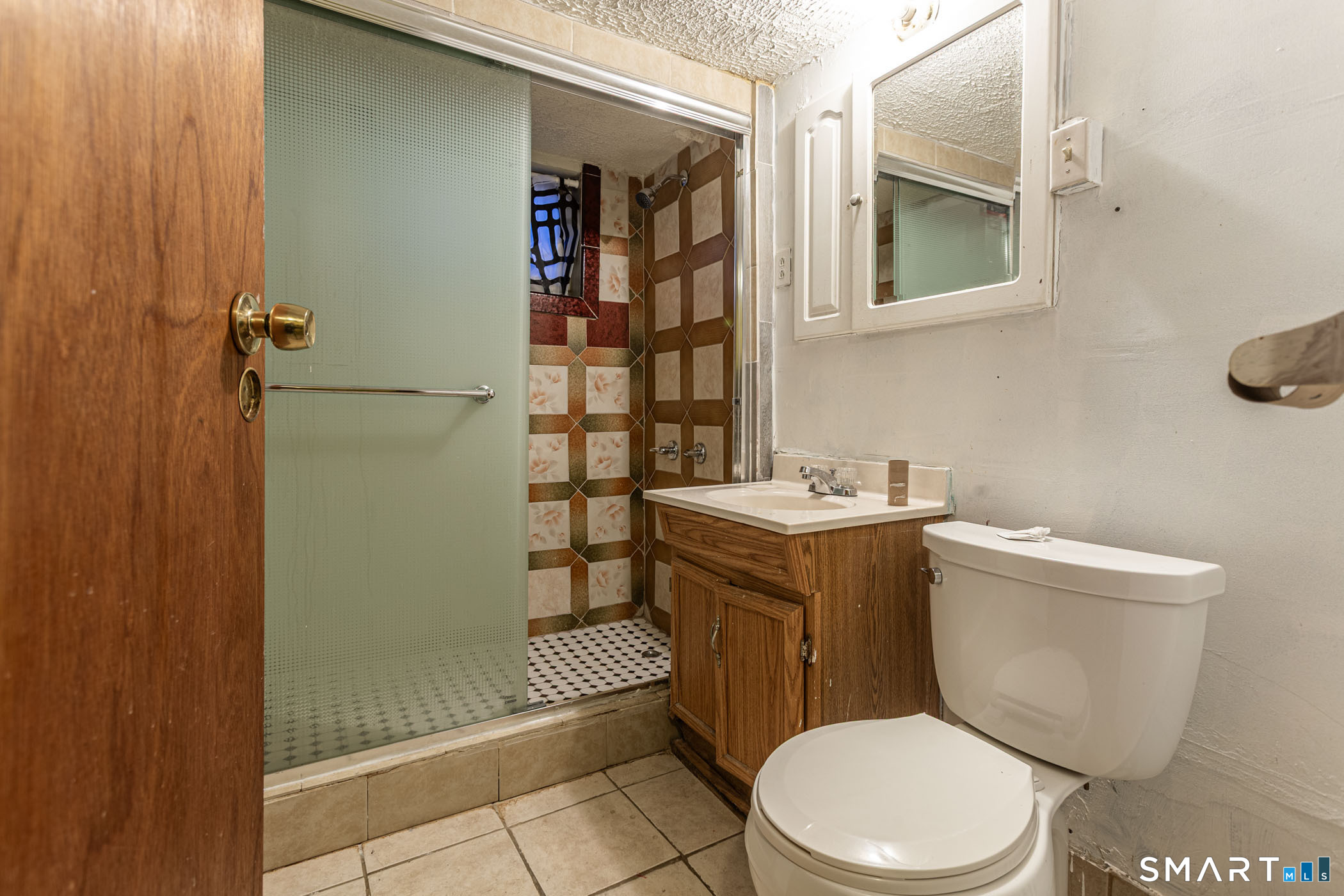 34 Adams Street Hartford, CT 06112 - Photo 31 of 39 a white toilet sitting next to a bathroom sink