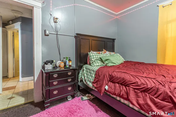 a bedroom with a bed and a dresser