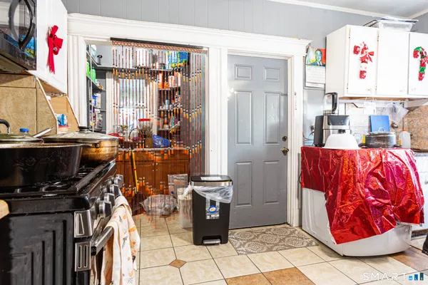 a view of a kitchen with furniture and window