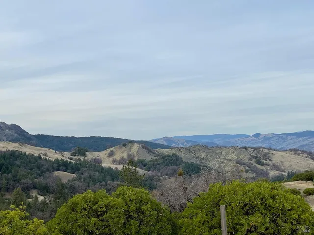 an aerial view of mountain and mountain in the background
