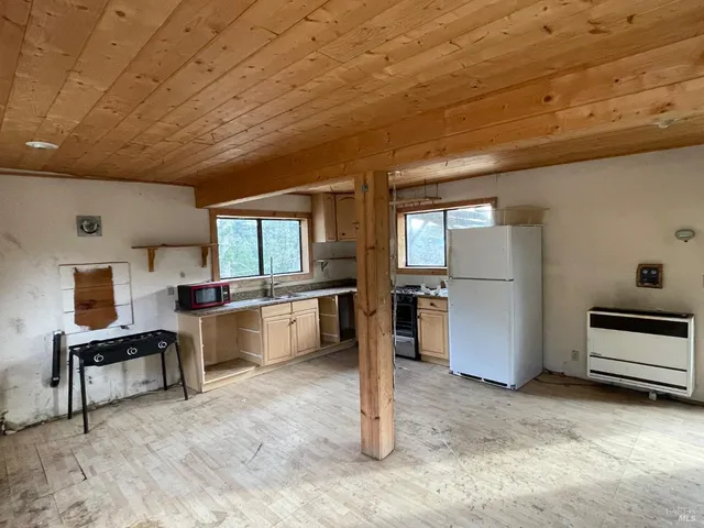 a view of a kitchen with furniture and a kitchen