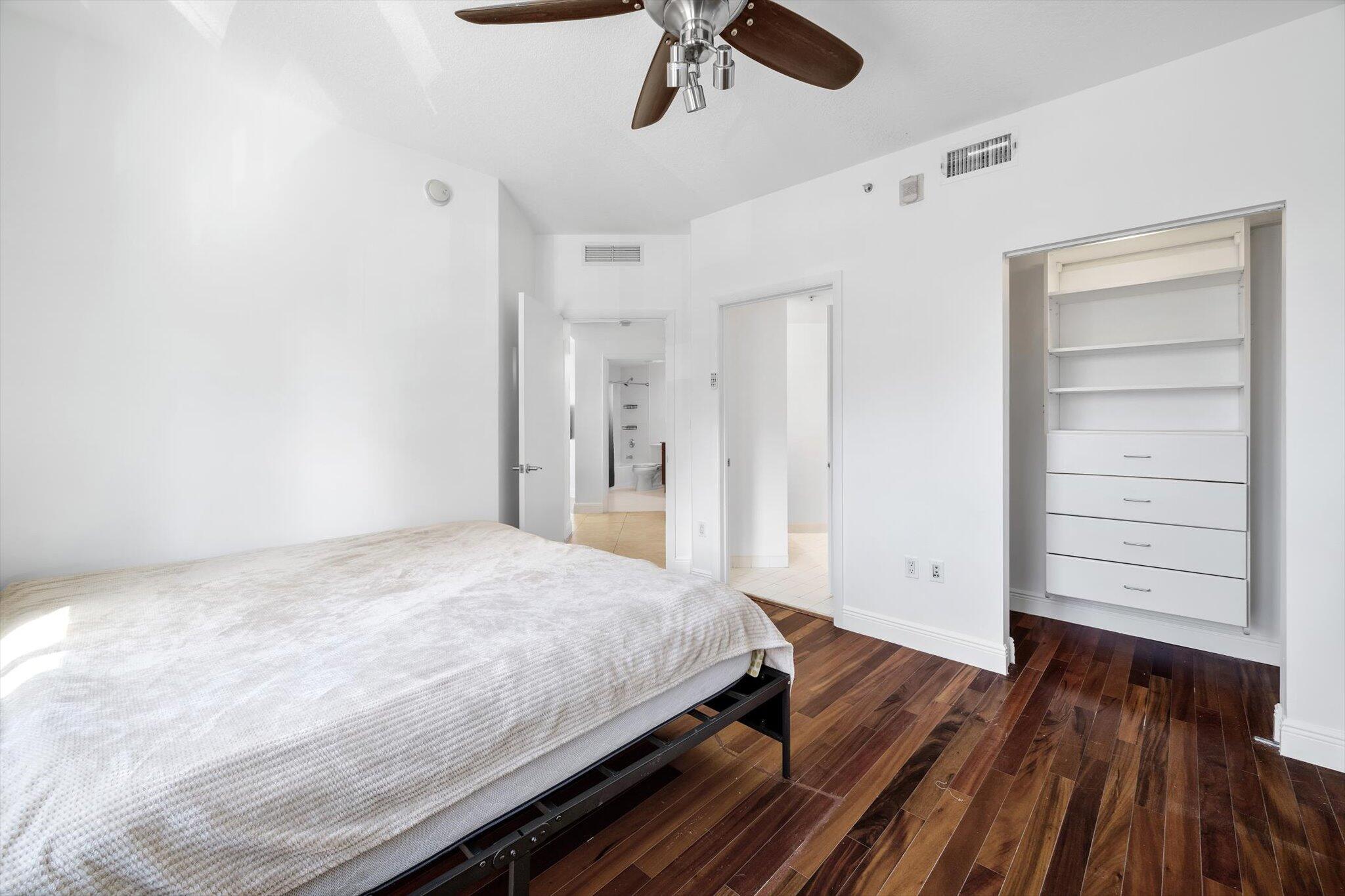 7270 Southwest 88th Street, Unit B203 Miami, FL 33156 - Photo 12 of 27 a bedroom with a bed and closet