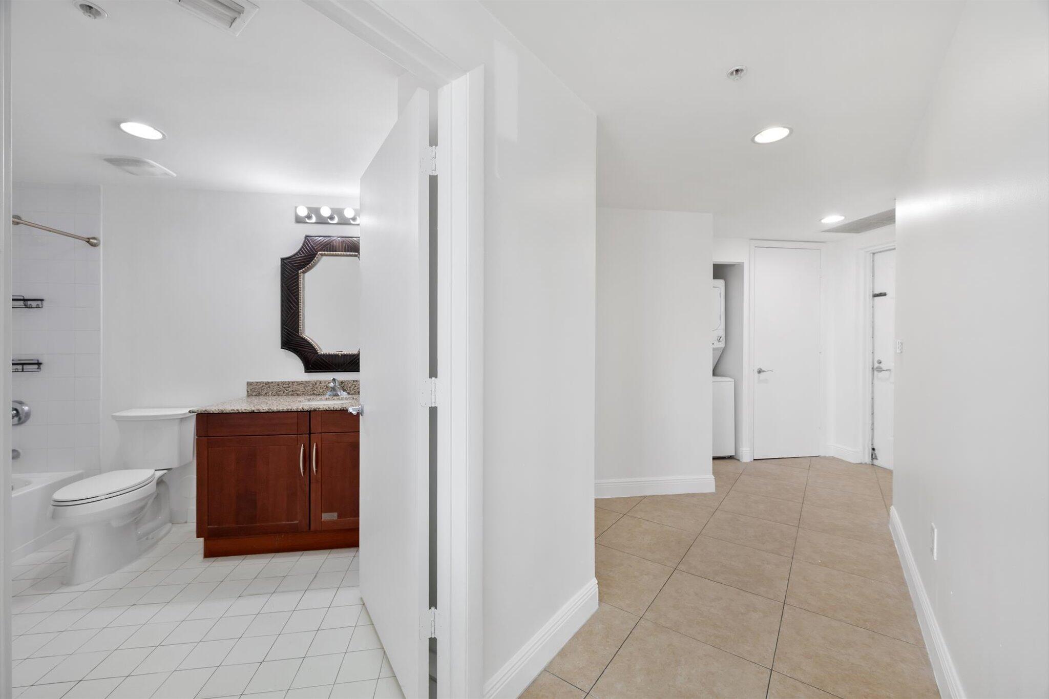 7270 Southwest 88th Street, Unit B203 Miami, FL 33156 - Photo 13 of 27 a bathroom with a toilet and a sink