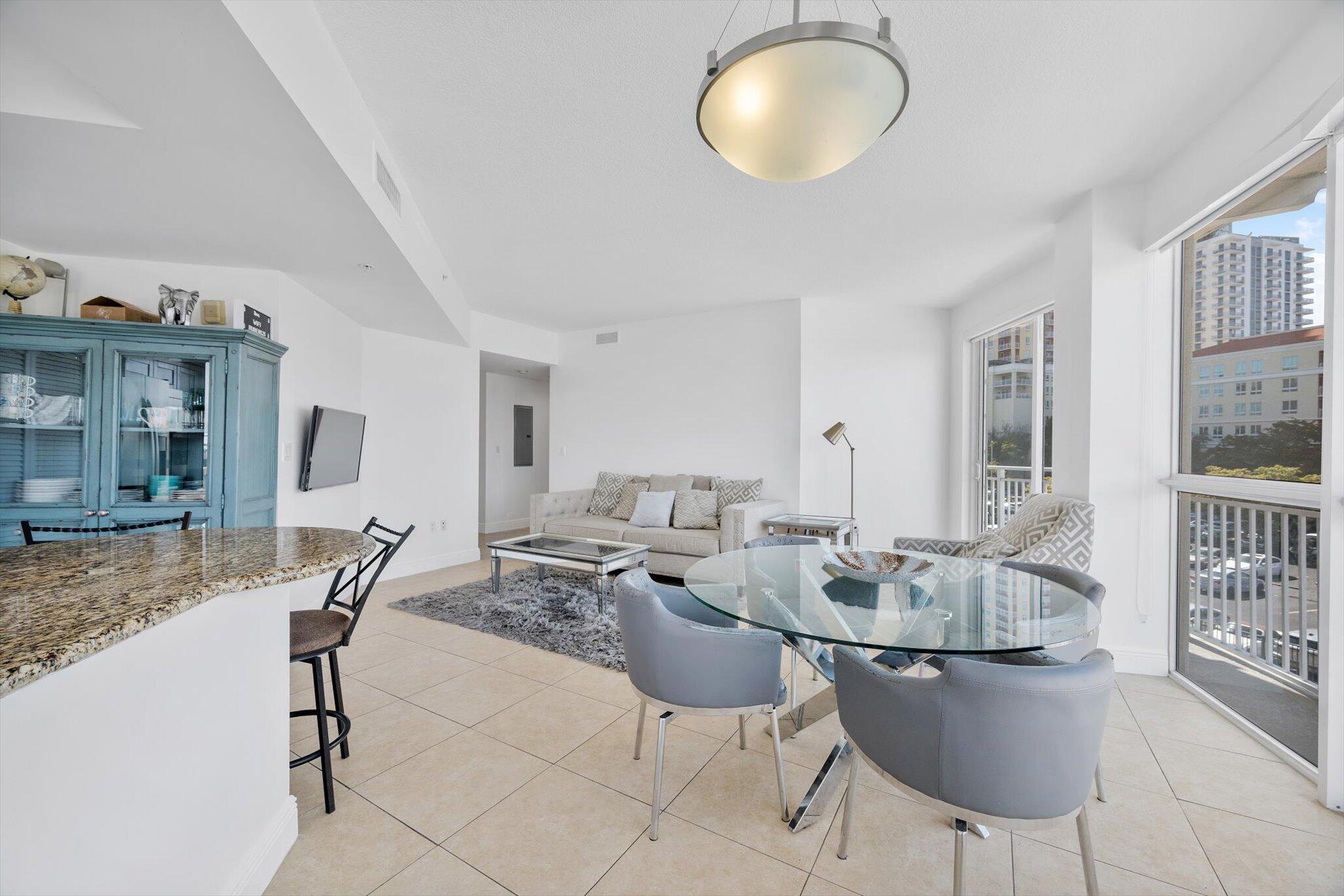 7270 Southwest 88th Street, Unit B203 Miami, FL 33156 - Photo 3 of 27 a living room with furniture a window and a table