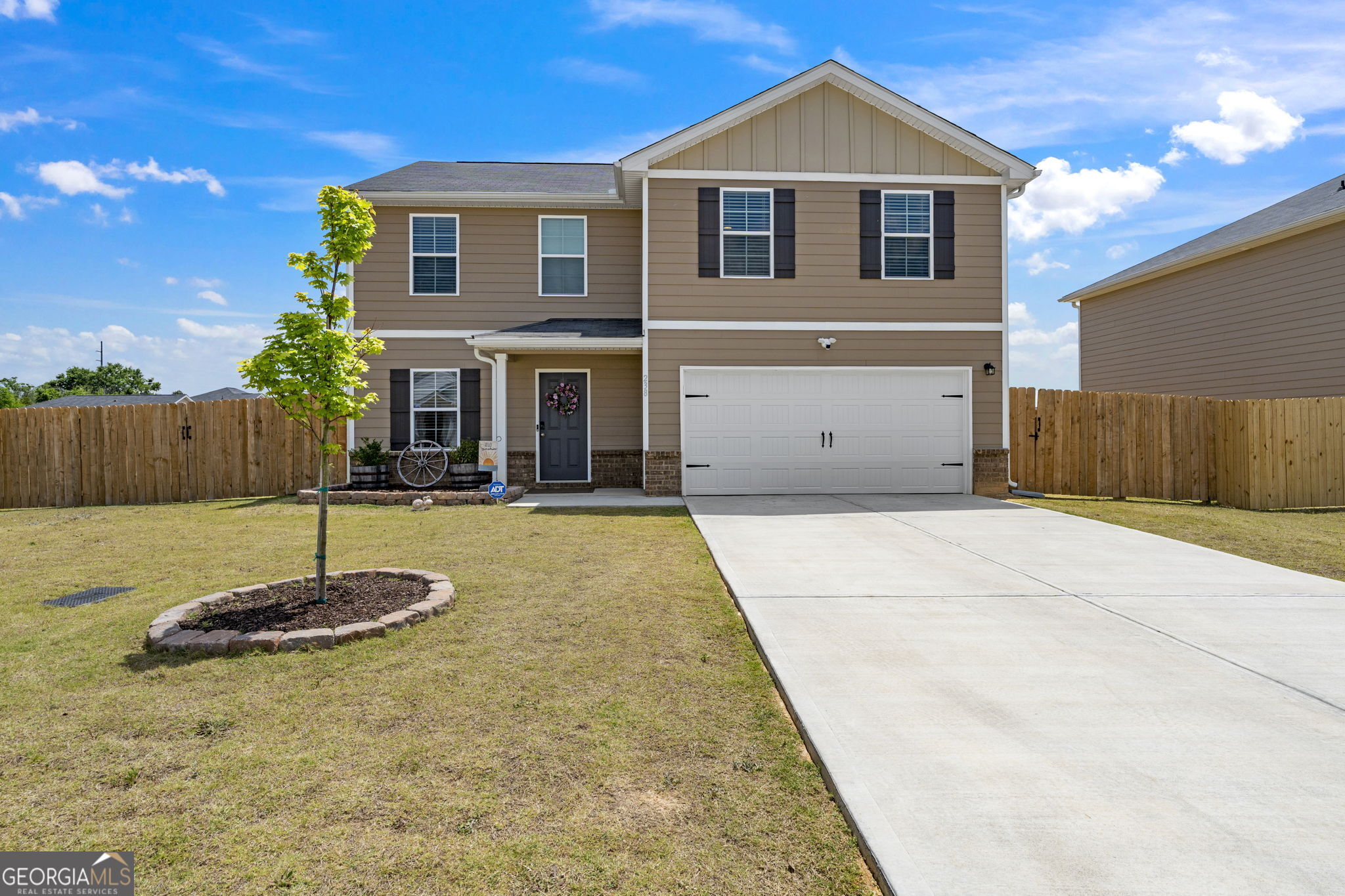 a front view of a house with a yard