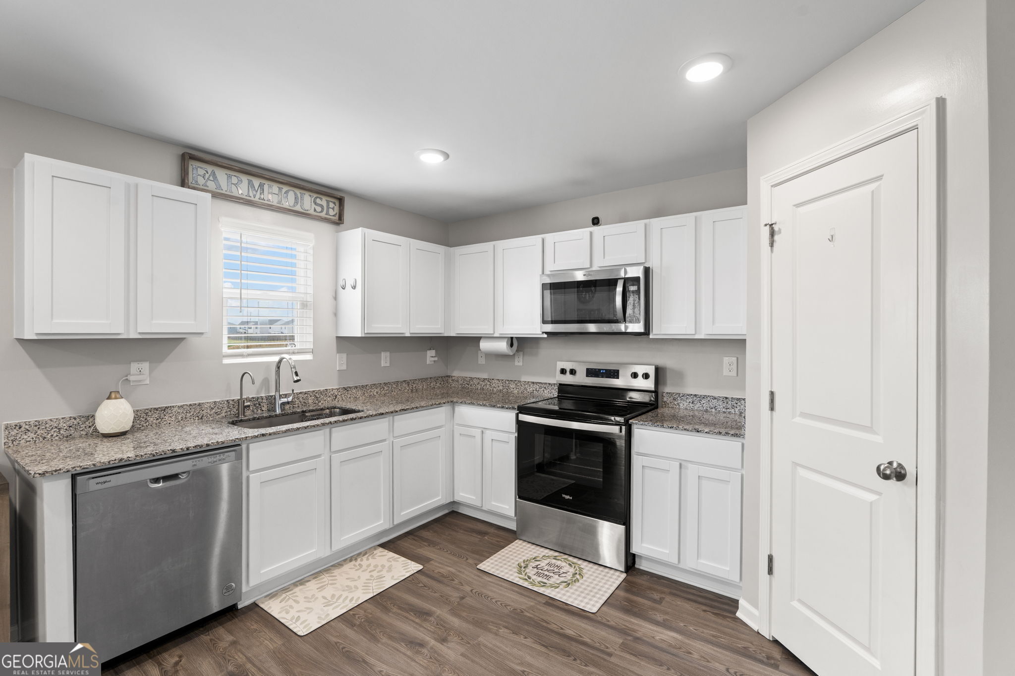 238 Isabella Way Byron, GA 31008 - Photo 13 of 37 a kitchen with stainless steel appliances granite countertop a stove a sink and a refrigerator