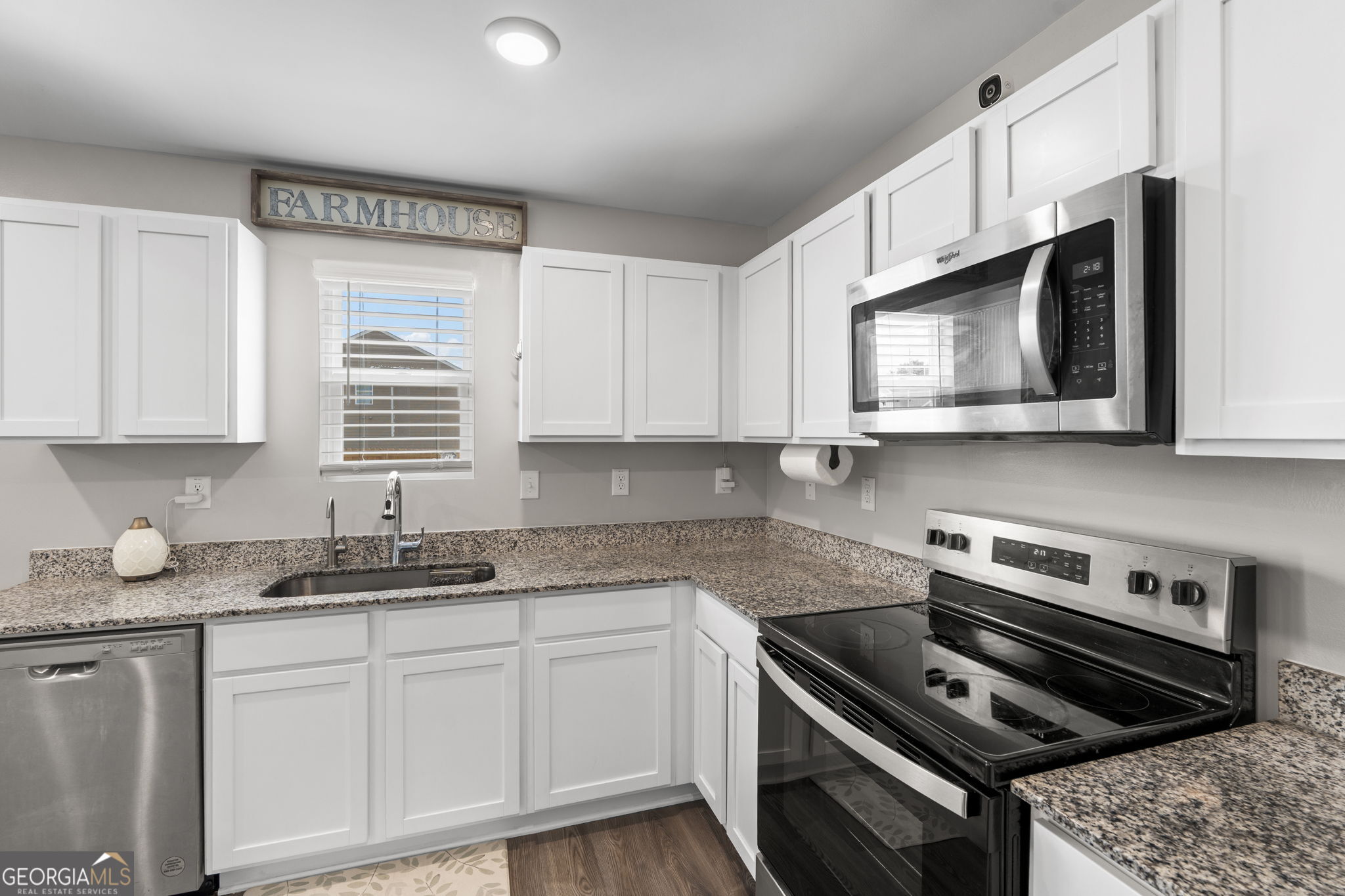 238 Isabella Way Byron, GA 31008 - Photo 14 of 37 a kitchen with stainless steel appliances a sink dishwasher stove microwave and cabinets
