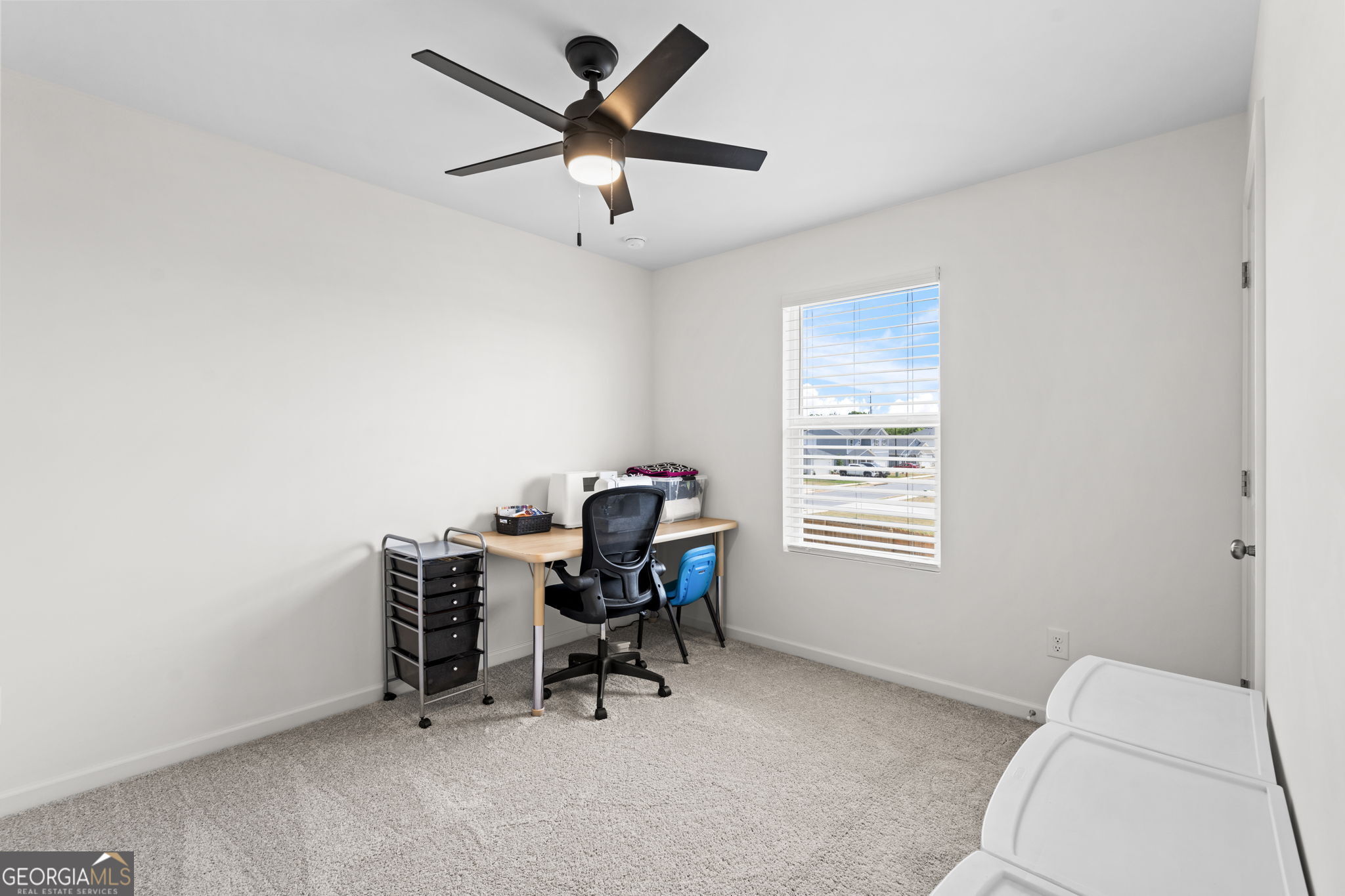 238 Isabella Way Byron, GA 31008 - Photo 18 of 37 a view of a workspace with furniture and a window
