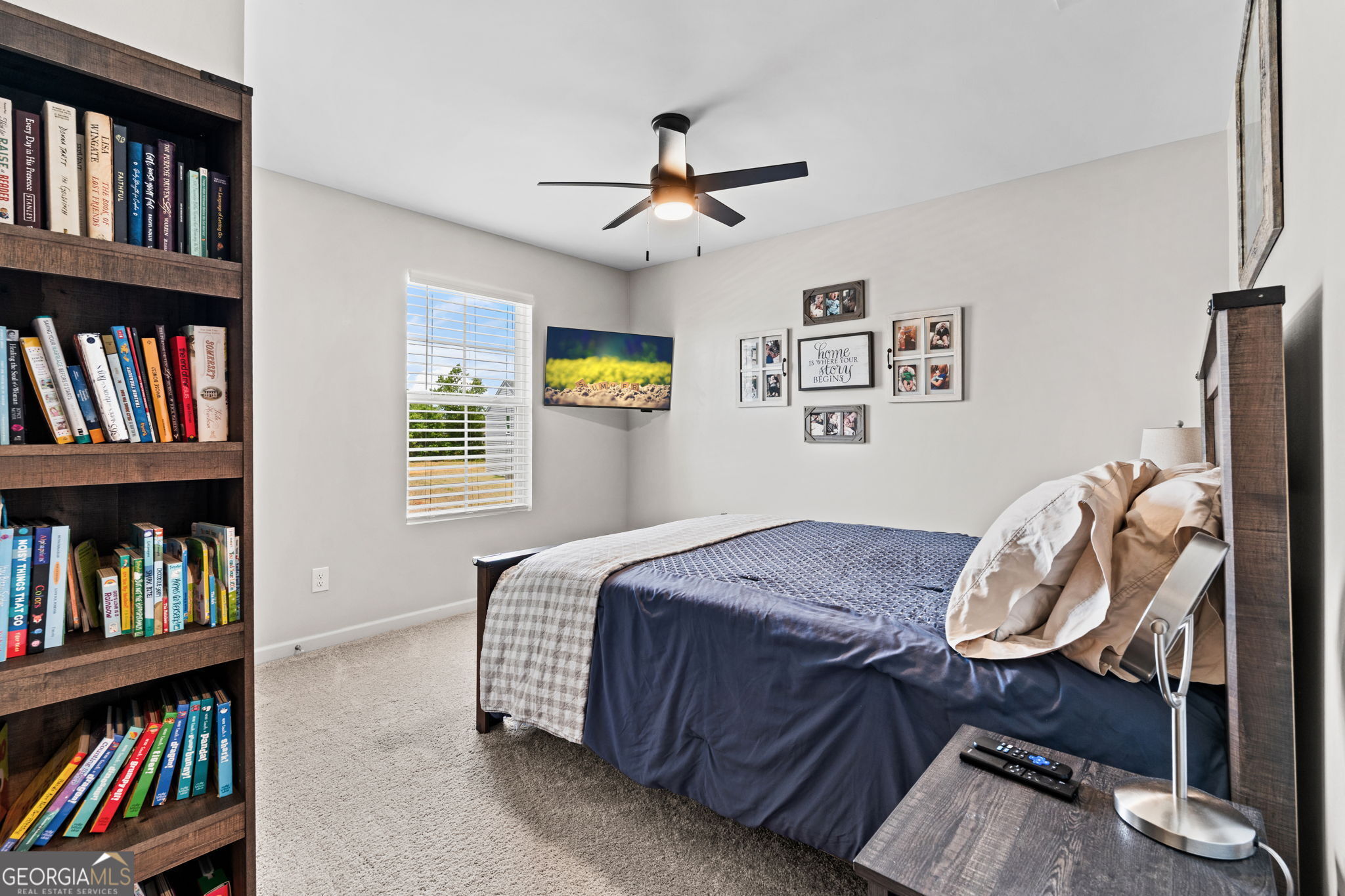 238 Isabella Way Byron, GA 31008 - Photo 20 of 37 a bedroom with a bed and a book shelf