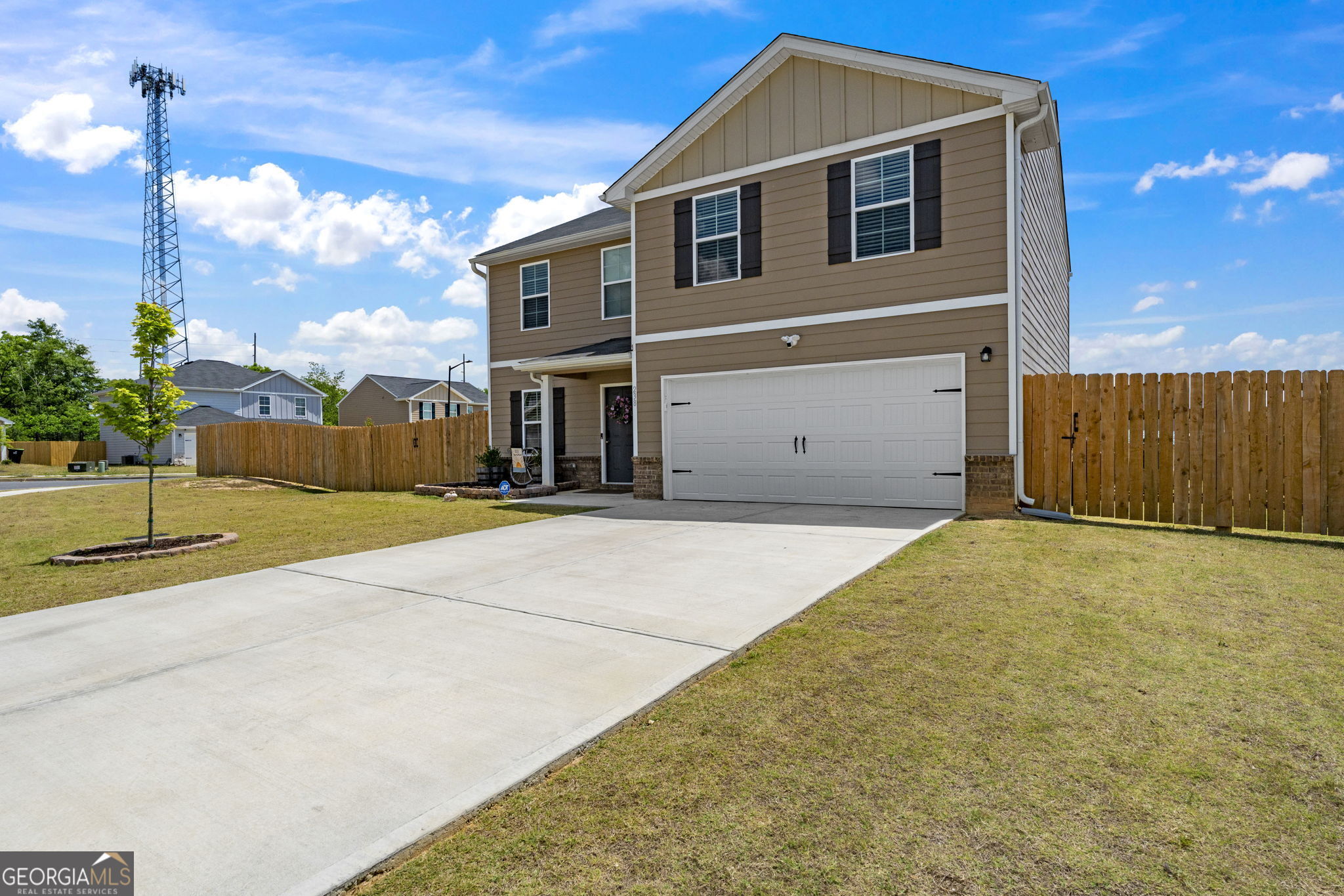 238 Isabella Way Byron, GA 31008 - Photo 2 of 37 a front view of a house with a yard