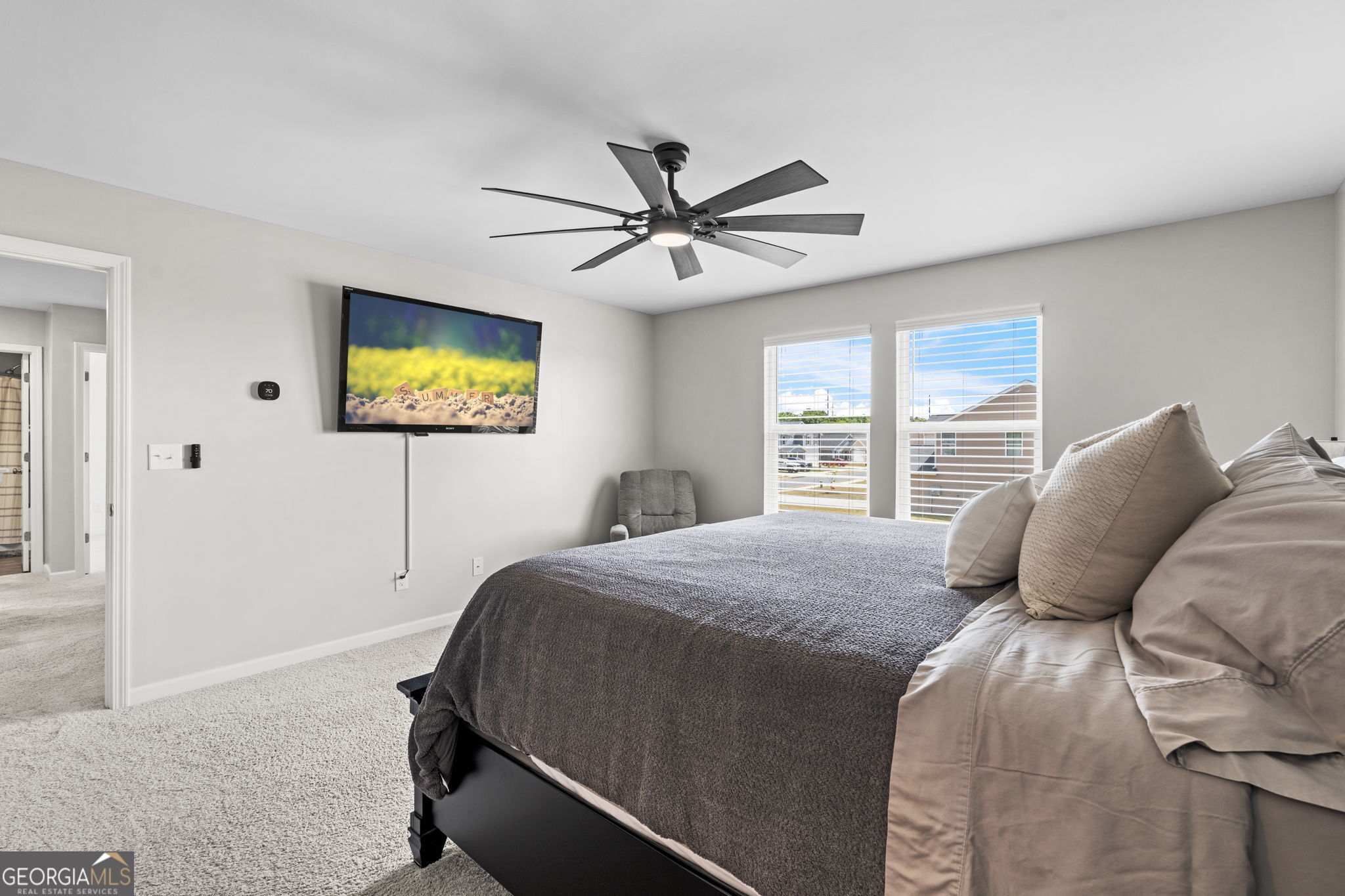 238 Isabella Way Byron, GA 31008 - Photo 28 of 37 a bedroom with a bed and a flat screen tv