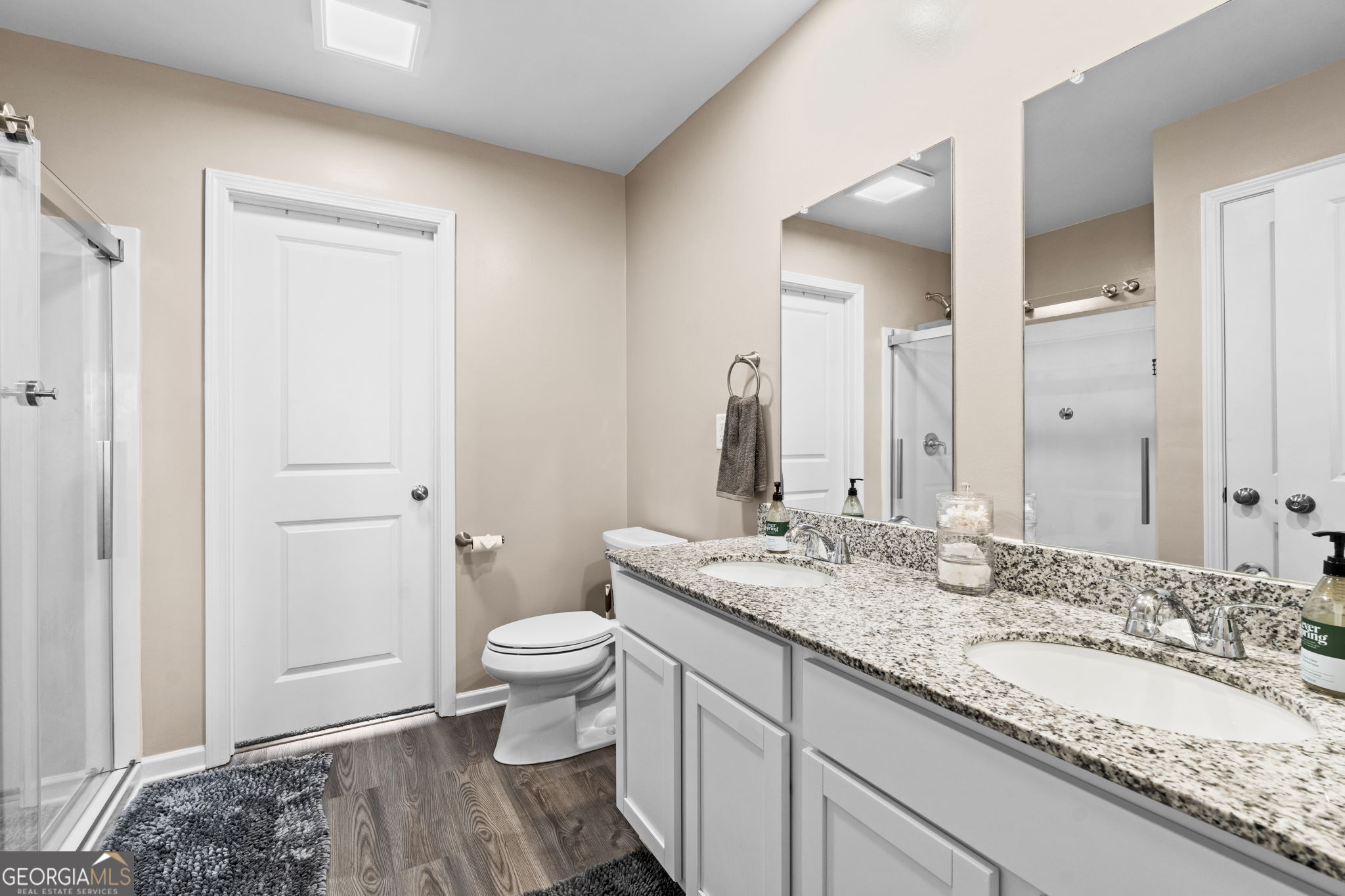 238 Isabella Way Byron, GA 31008 - Photo 29 of 37 a bathroom with a granite countertop sink and a mirror