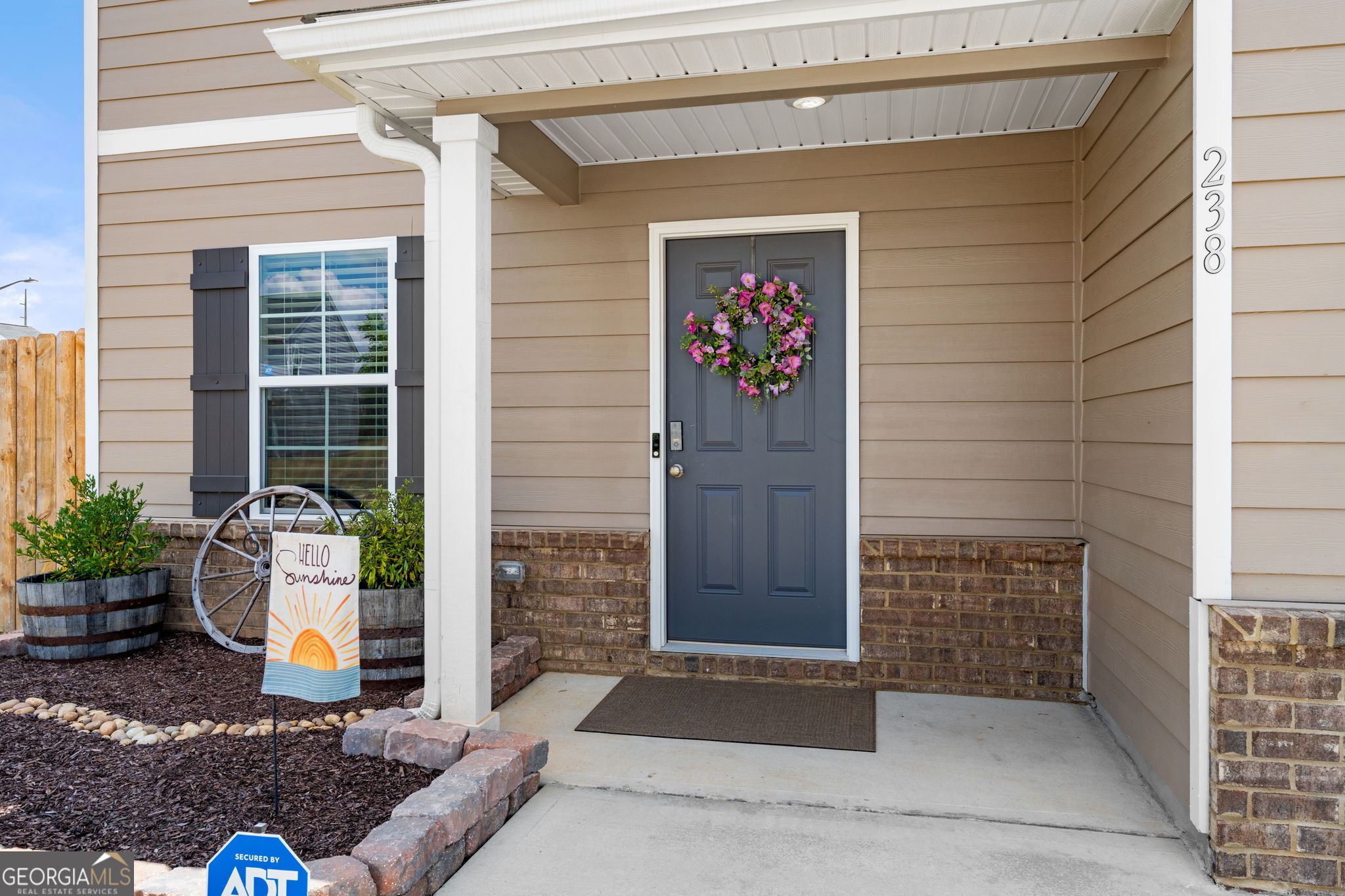 238 Isabella Way Byron, GA 31008 - Photo 3 of 37 a front view of a house with outdoor seating