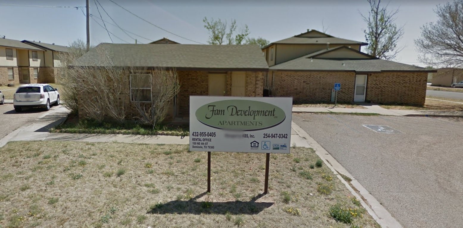 100 Northeast 4th Seminole, TX 79360 - Photo 2 of 7 a table and chairs in a patio
