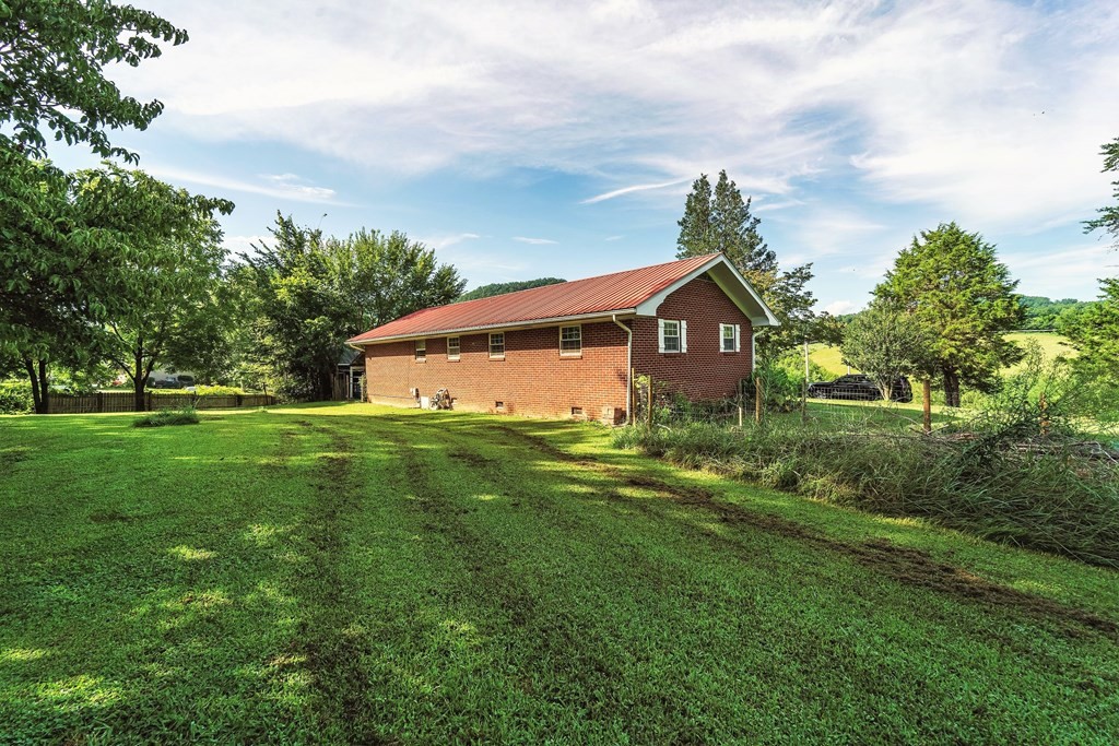 622 Lower Bogard Road Newport, TN 37821 - Photo 31 of 34 a view of a house with a big yard plants and large trees