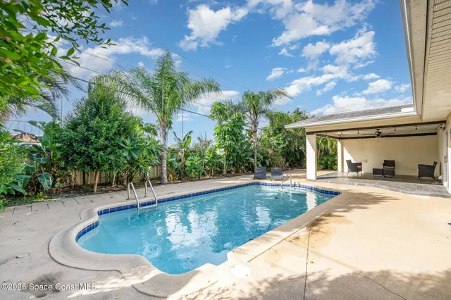 a view of a house with swimming pool