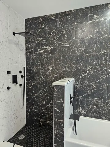 a bathroom with a shower and a toilet