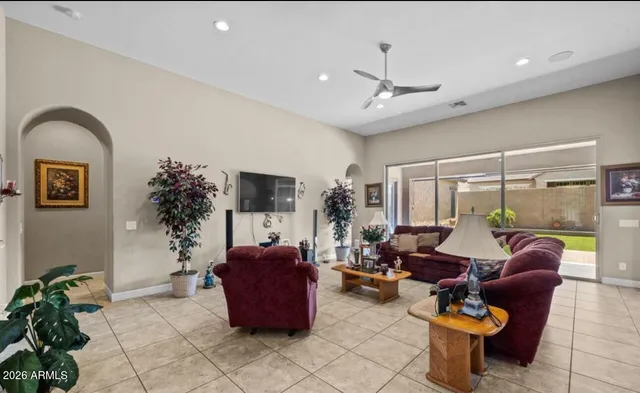 a living room with furniture and a large window