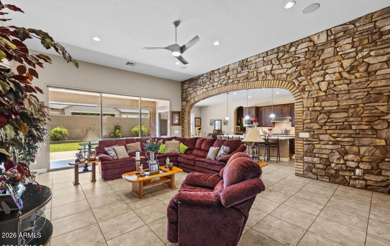 2915 East Constance Way Phoenix, AZ 85042 - Photo 16 of 47 a living room with furniture and a chandelier
