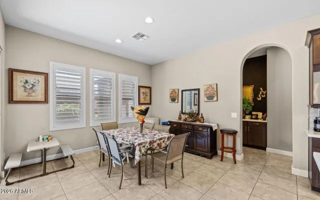 a dining room with furniture and window