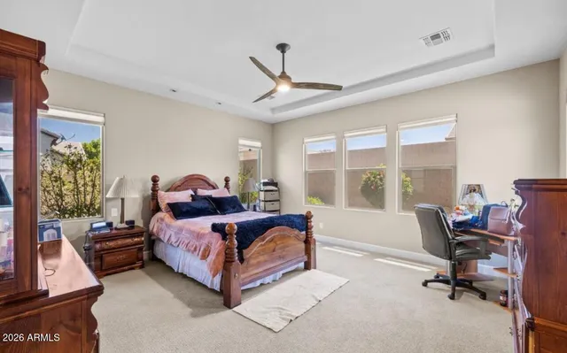 a bed room with a bed and a chair