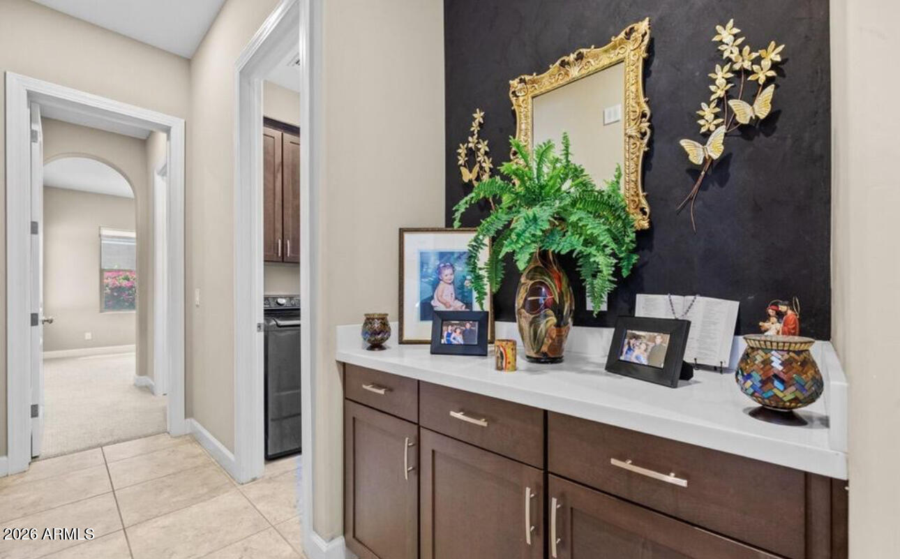 2915 East Constance Way Phoenix, AZ 85042 - Photo 28 of 47 a bathroom with a sink a mirror and vanity