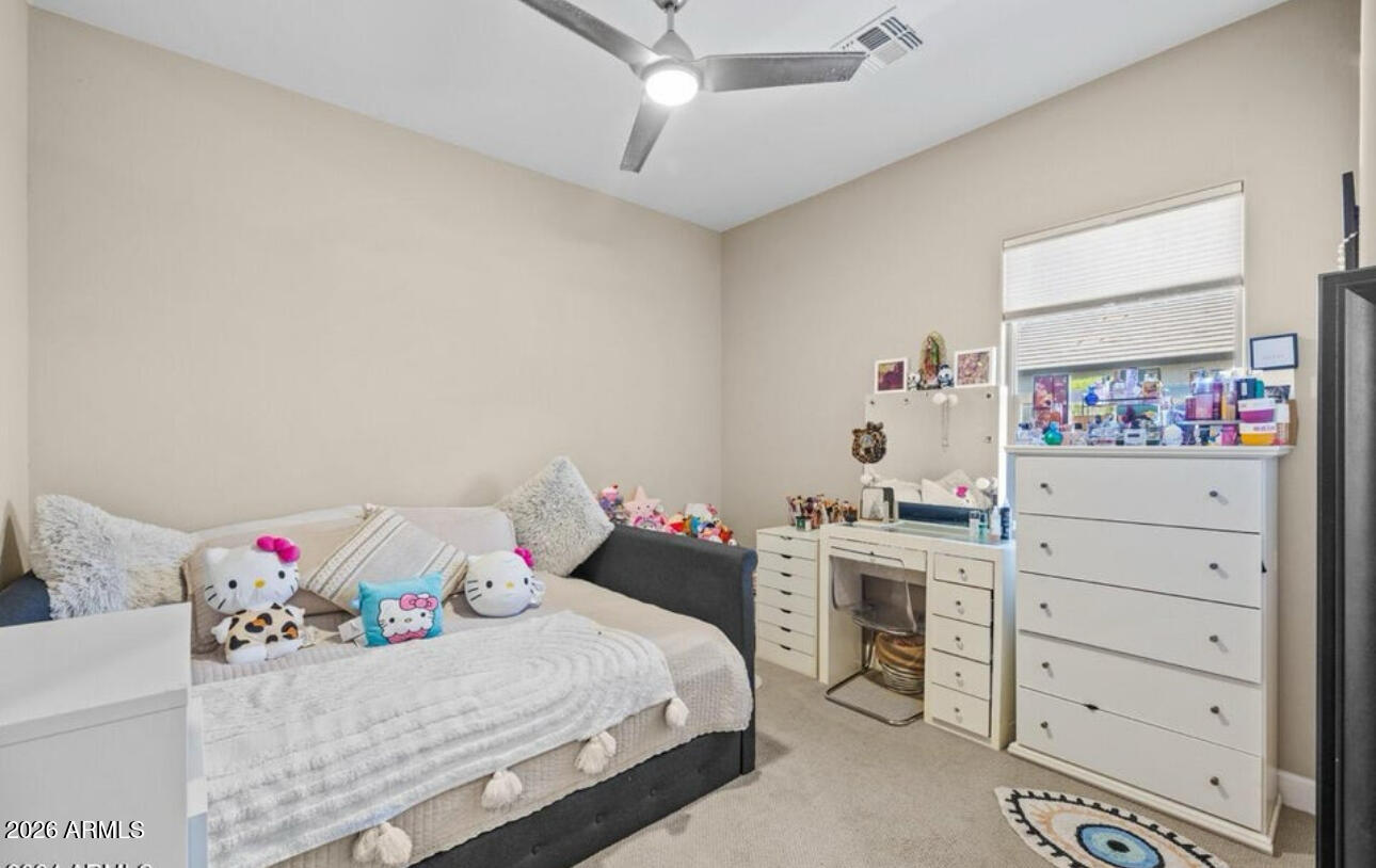 2915 East Constance Way Phoenix, AZ 85042 - Photo 31 of 47 a bedroom with a bed and a window