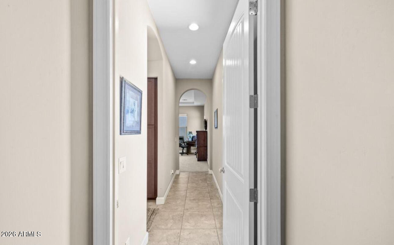 2915 East Constance Way Phoenix, AZ 85042 - Photo 32 of 47 a view of a hallway with wooden shelves
