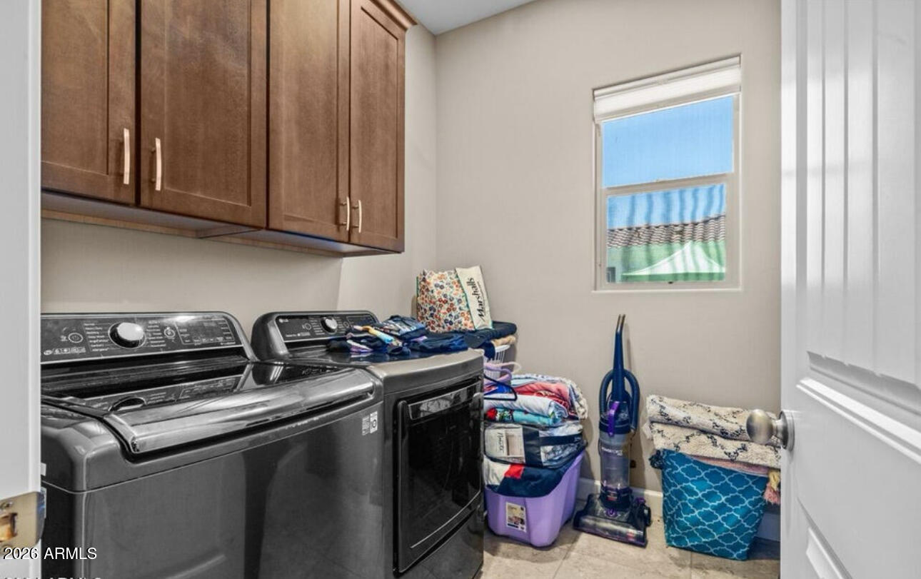 2915 East Constance Way Phoenix, AZ 85042 - Photo 39 of 47 a utility room with fridge dryer and washer