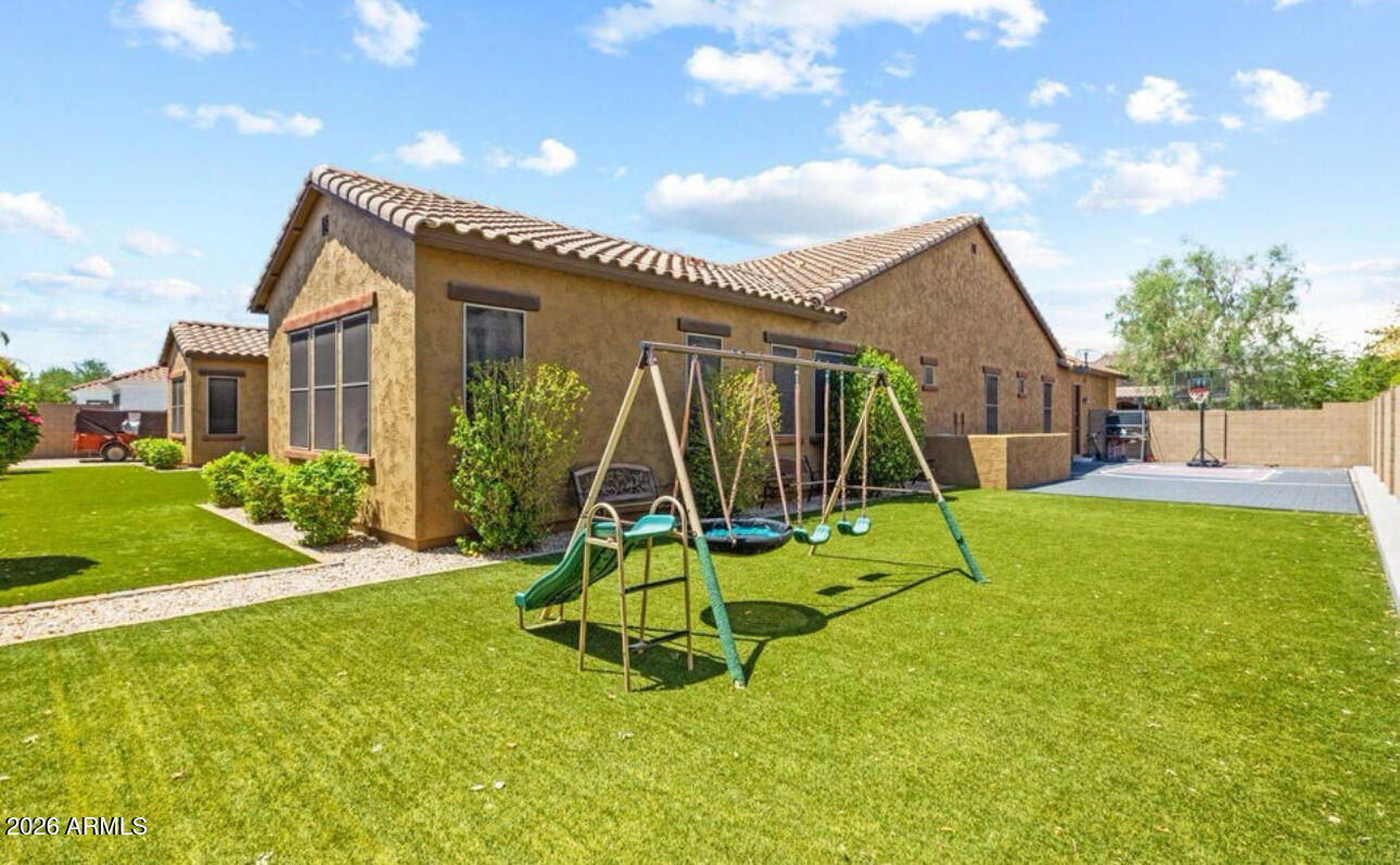 2915 East Constance Way Phoenix, AZ 85042 - Photo 43 of 47 a view of a house with backyard and a slide