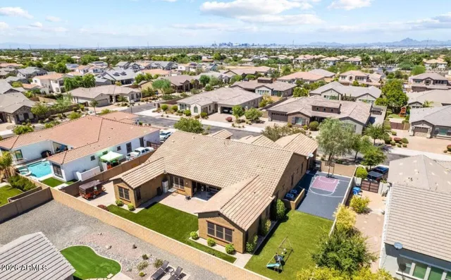 an aerial view of a house with a ocean view