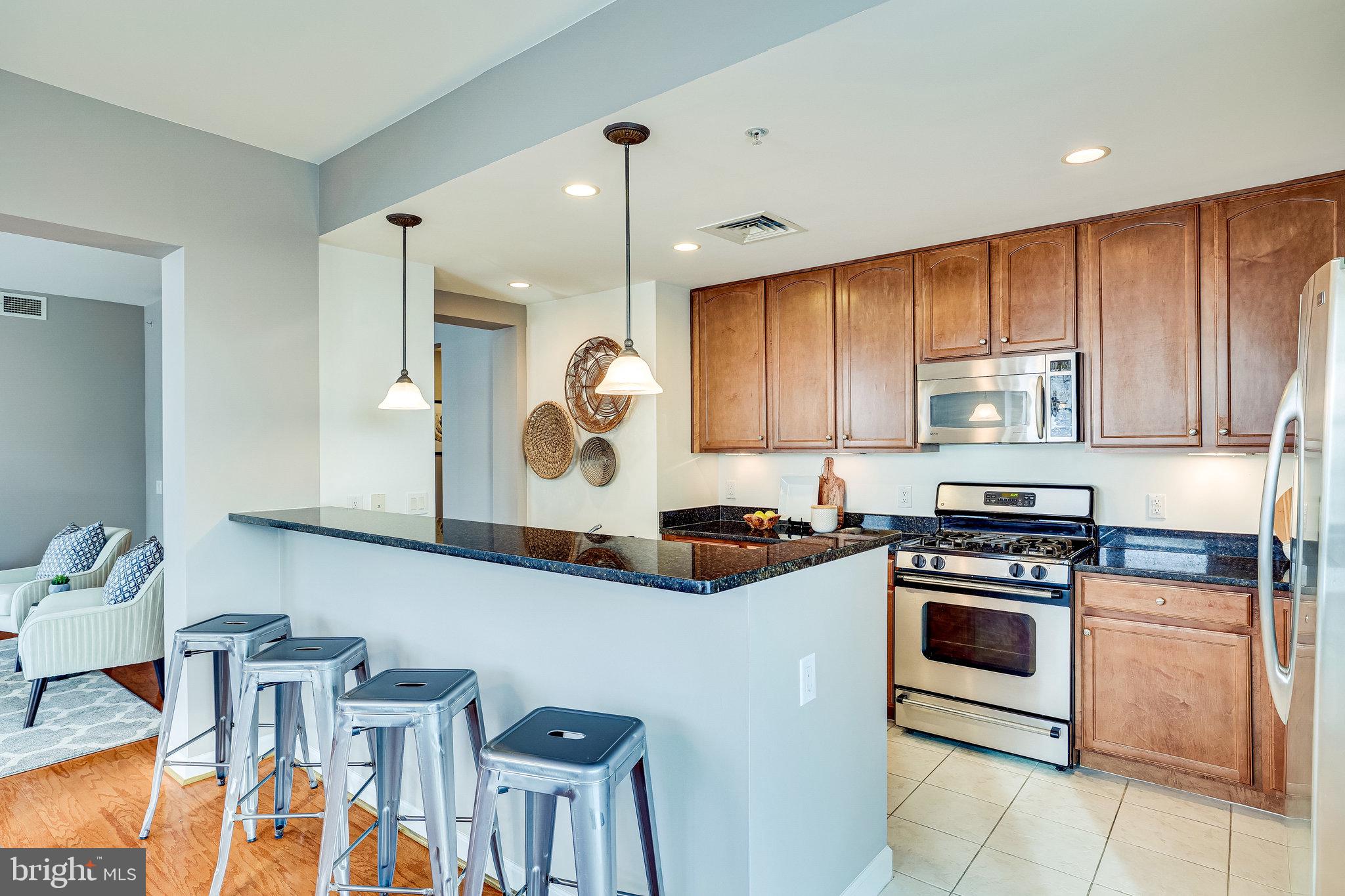 1830 Fountain Drive, Unit 1008 Reston, VA 20190 - Photo 13 of 42 Extra seating is available at the breakfast bar.