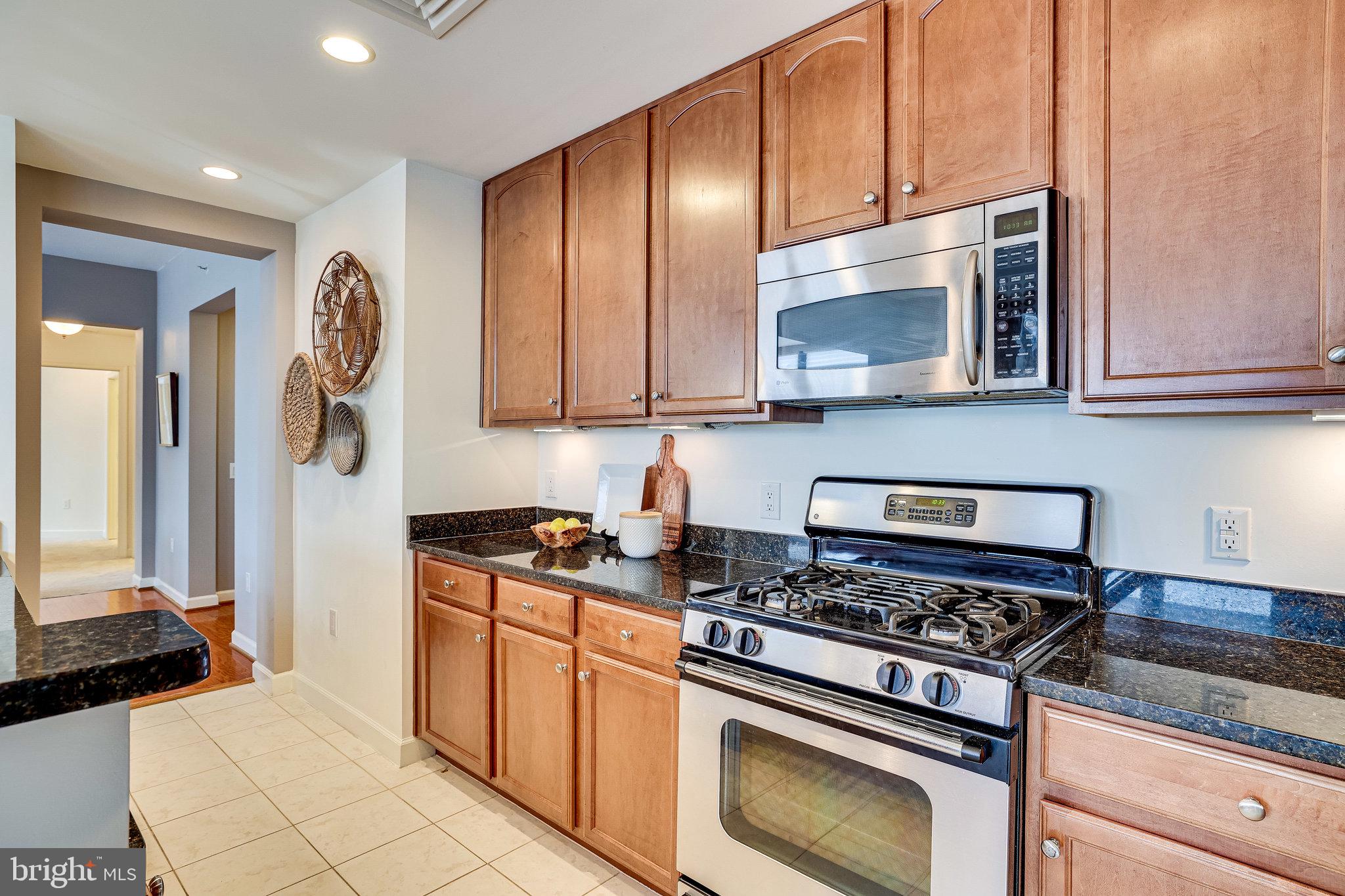 1830 Fountain Drive, Unit 1008 Reston, VA 20190 - Photo 14 of 42 42" cherry cabinets and stainless appliances.
